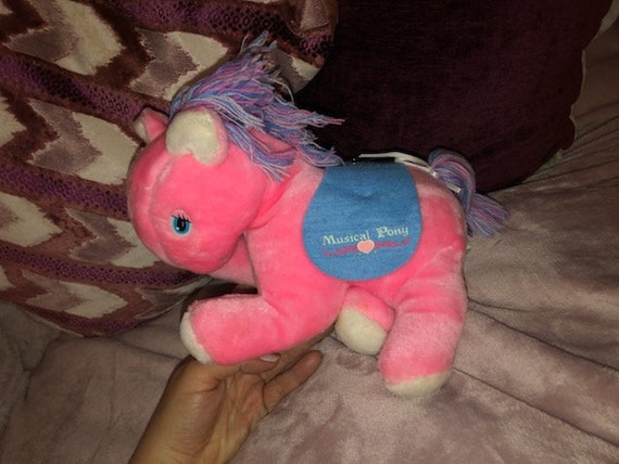 stuffed pink pony