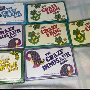 Vintage Das Crazy Spiel Frosch Dinosaurier Flugzeug Schildkröte Lot Multiples ECU zu Gut