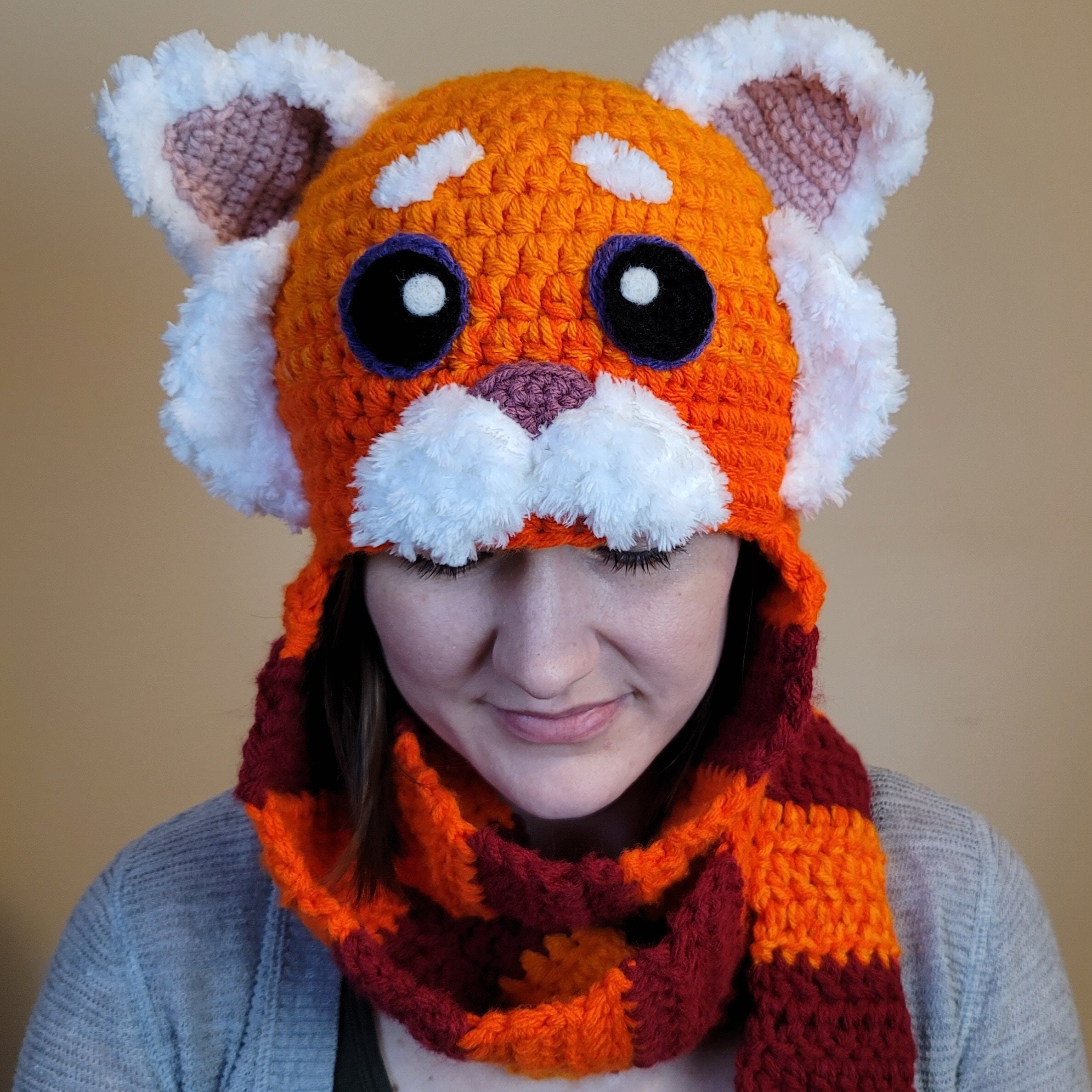 cappello con sciarpa attaccata