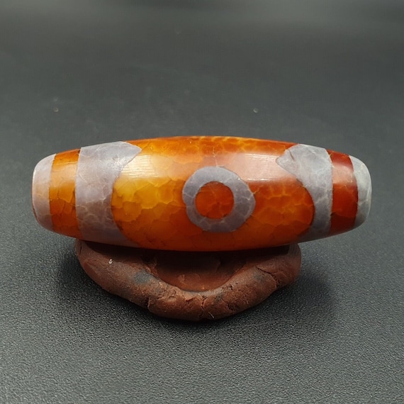 Beautiful indo tibetan etched line decorated tapered tube 2 eye dzi beads
