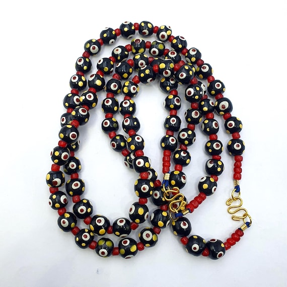 Black venetian style hundred red eyes skunk  beads necklace10mm & 20 inches long