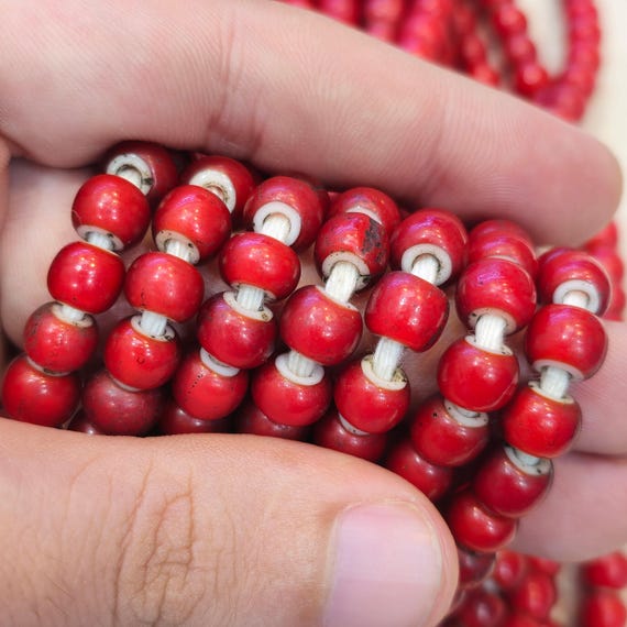 Antique-style white heart trade beads from Venice in an 8mm size are showcased lengthy strand Gift