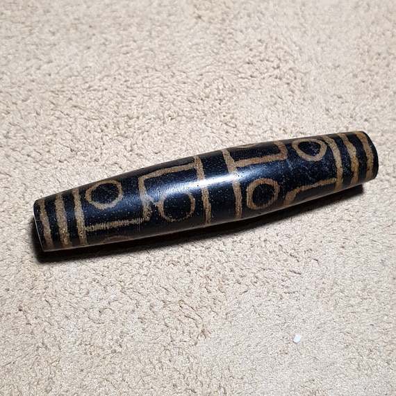 Eyes pattern antiquity trade pumtek petrified wood bead 57..4mm