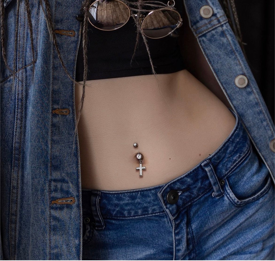 Cross belly button piercing deals
