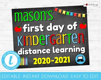 May include: A chalkboard sign with the text "mason's first day of Kindergarten distance learning 2020-2021". The sign is decorated with colorful flags, crayons, and a red apple.