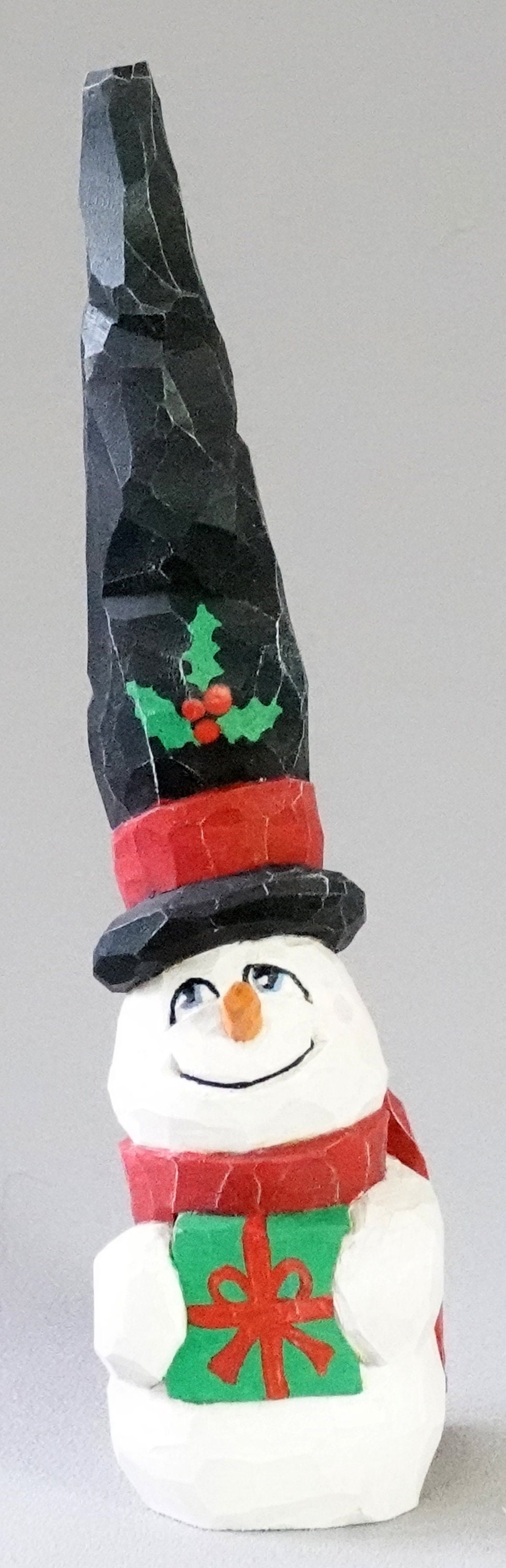 Snowman Wood Art, Wood Carving, Snowman with Long Black Top Hat Holding Green Present SN14 9” X 2” X 2”