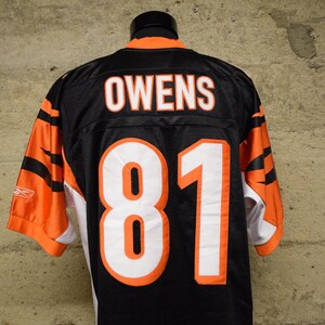 May include: Black and orange football jersey with the name "OWENS" and the number "81" on the back.