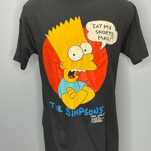 May include: A set of three ceramic mugs with a speckled, matte finish. The mugs are in shades of cream, light gray, and dark gray. Each mug has a simple, minimalist design, perfect for coffee or tea.