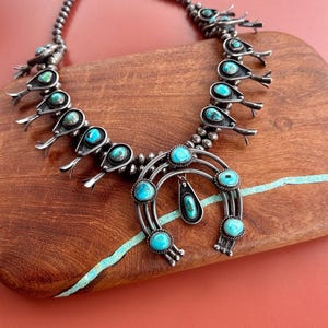 Vintage Navajo sterling silver and twenty-stone shadow box turquoise squash blossom necklace