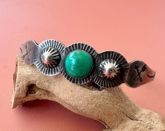 Vintage Fred Harvey era Navajo sterling silver and green circular turquoise cuff bracelet with repoussé detail
