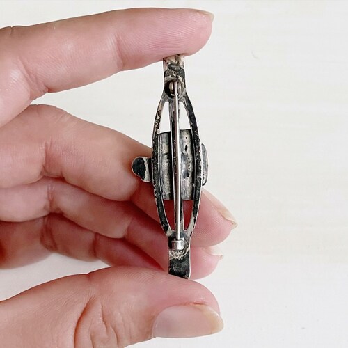 Vintage Fred Harvey era Navajo sterling silver and turquoise thunderbird brooch or pin with stamped shops detail