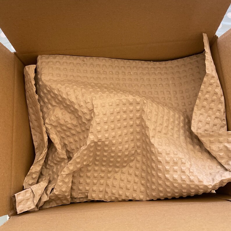 Brown paper bubble packaging in a brown box.