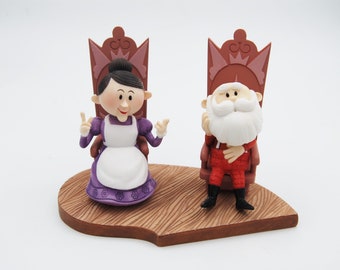 Rudolph and the island of misfit toys 875392 "Have holly, jolly christmas" santa sitting figurine by Enesco