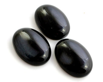 Black Agate Cabochon. A Shiny Polished Dark Colored Stone with Very Faint White Patch. An Oval Shaped Decoration for Embroidery Projects