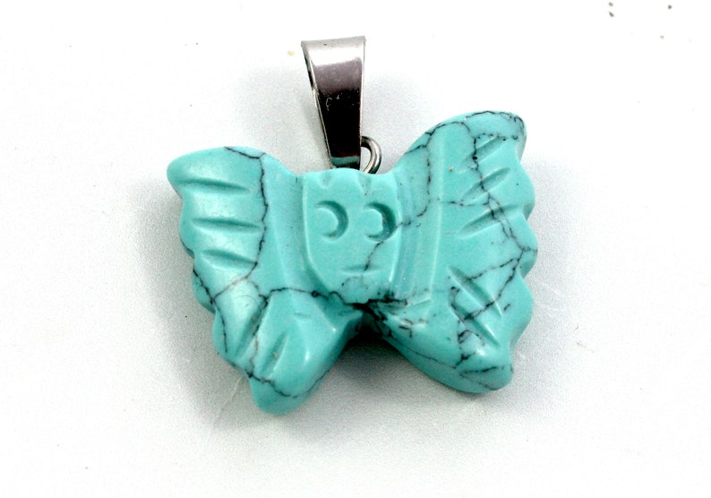 Howlite Butterfly Pendant A Turquoise Colored Stone Ornament for Making Animal Lover Jewelry A Blue Carved Gemstone Insect Decoration