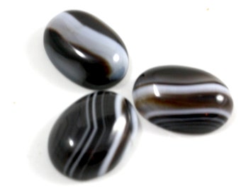 Black Agate Cabochon with Wide White Stripes. A Dark Colored Stone for Making Matching Pendants. An Oval Decoration with a Flat Bottom