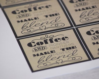 May include: Four brown paper gift tags with black text that reads "Coffee and Pioneer Partners Make the Perfect Blend".