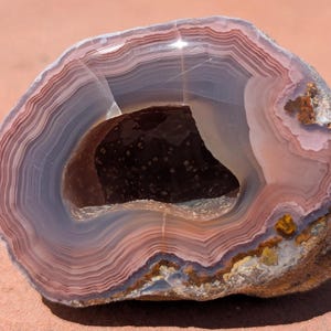 Calming Laguna Agate features "mauve -lous"  rose, lavender and dark pink banding. Hand polished in Sedona, Arizona