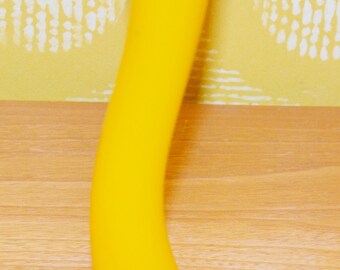 May include: A bright yellow glass vase with a curved design. The vase is empty and has a smooth, glossy finish.