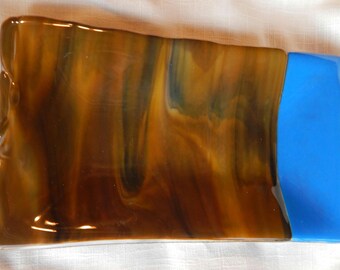 Rectangle plate, 5.25 x.9.5 inches. Opalescent blue and woodland brown swirls on bottom.