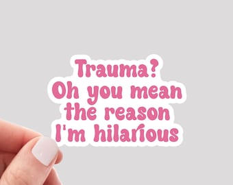 May include: Pink sticker with the text "Trauma? Oh you mean the reason I'm hilarious".