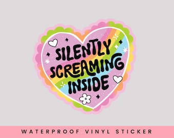 May include: A pink heart-shaped sticker with a rainbow design and the text "SILENTLY SCREAMING INSIDE".  The sticker is waterproof vinyl.