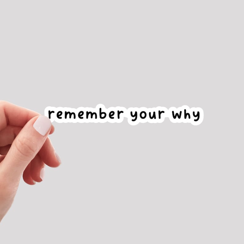 May include: White sticker with black text that reads "remember your why".