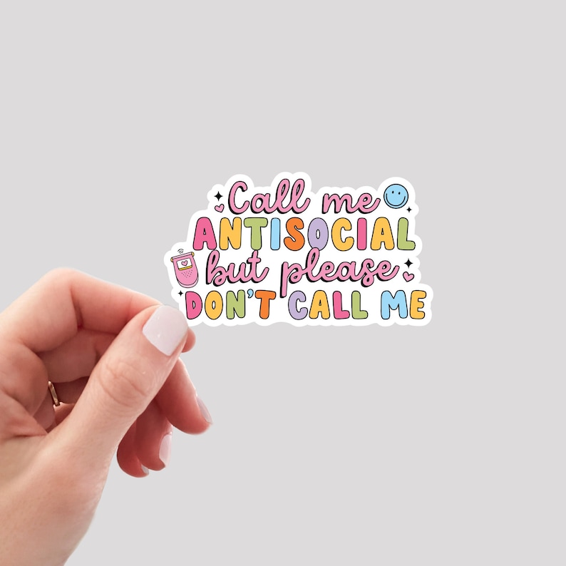 May include: A sticker with the text "Call me antisocial but please don't call me" in colorful letters with a smiley face and a phone icon.