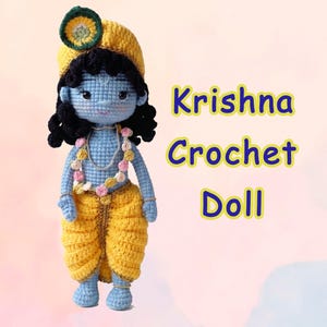 May include: A handmade crochet doll with light blue skin, black curly hair, and a yellow turban featuring a peacock feather. The doll wears a yellow dhoti and a floral garland. The text Krishna Crochet Doll is printed to the right of the doll.