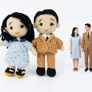 Close-up of a personalized amigurumi couple with custom details, perfect 1st anniversary (paper/cotton) gift created from reference photos.