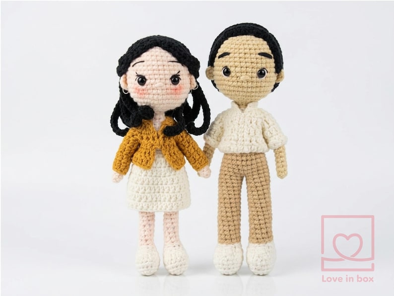 Personalized "Mini Me" couple crochet dolls holding hands, highlighting the artist's ability to capture specific hairstyles and outfits from photos.