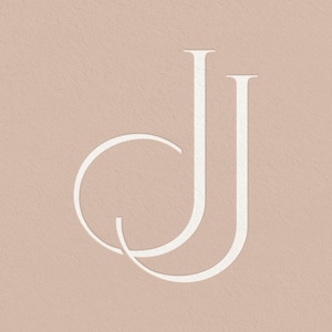 May include: A white monogram logo featuring the letters "JJ" in a stylised font. The "J" on the left is a circle with a line extending downwards. The "J" on the right is a straight line.