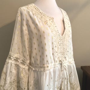 May include: A set of three ceramic mugs with a speckled, matte finish. The mugs are in shades of cream, light gray, and dark gray. Each mug has a simple, minimalist design, perfect for coffee or tea.