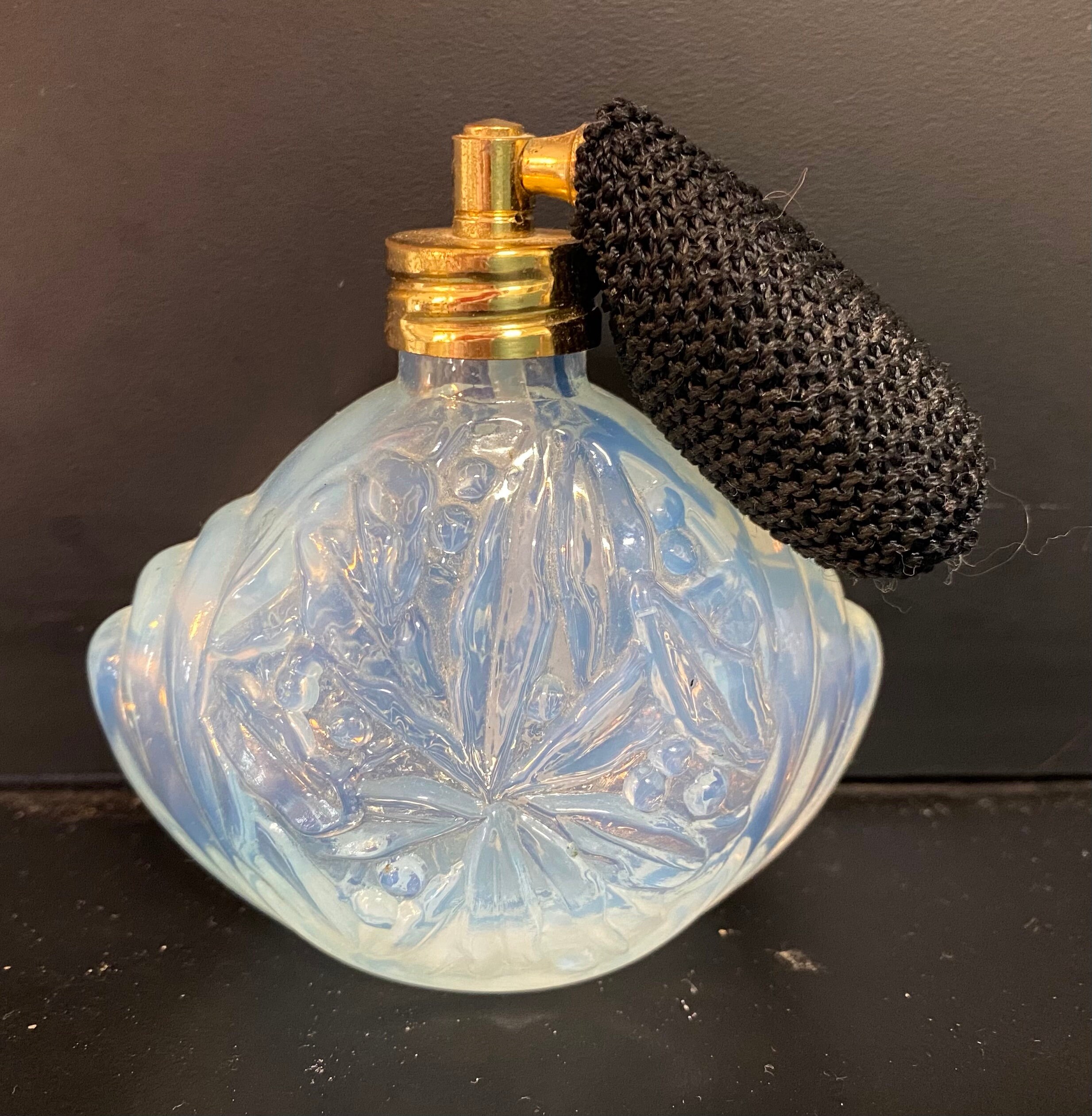 vintage antique perfume bottle with effect of perfume spray on