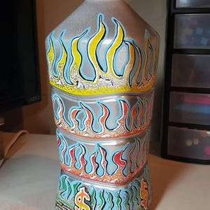 Flamed coin stash! Drop your loose change in this hand-painted coin stash. Ideal for the mancave or give your kids a cool incentive to save!