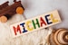 Wooden Name Puzzle with Pegs    Independently Tested, Child Safe Made in the USA --Perfect Newborn Gift 