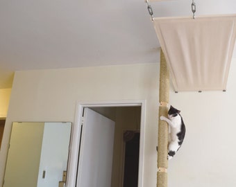 Cat Pole! Cats can climb from floor to ceiling for play and exercise. Turn your bookcase or cabinets into a cat duplex.