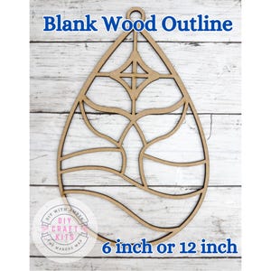 May include: A blank wood outline in a teardrop shape, featuring an intricate cutout design. The text "Blank Wood Outline" is at the top, and "6 inch or 12 inch" is at the bottom. The DIY Craft Kits logo is also visible.