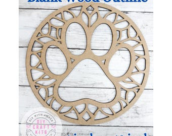May include: A blank wood outline in the shape of a paw print, with decorative cutouts around the edges. The text "Blank Wood Outline" is at the top, and "6 inch or 12 inch" is at the bottom. The craft kit is from DIY with Amber.
