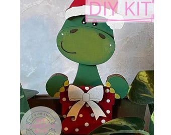 Santa Hat Dino Hugger DIY Craft Kit | Christmas Dinosaur Gift | Interchangeable Decor | Wood Dino Cutout | Seasonal Decor | Adult Crafting
