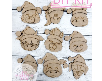 Puede incluir: Kit de manualidades DIY con nueve adornos de madera sin terminar en forma de caras de animales que llevan gorros de Papá Noel. Los adornos están listos para ser pintados y decorados.