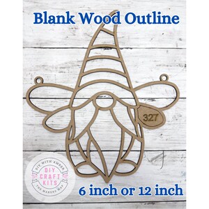 May include: A blank wood outline of a gnome with the text "Blank Wood Outline" at the top. The gnome has a pointed hat, a long beard, and a round nose. The text "6 inch or 12 inch" is at the bottom.
