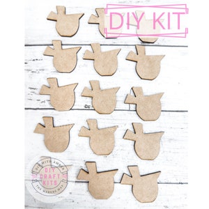 May include: A DIY craft kit with 15 unfinished wooden bird shapes. The shapes are all the same size and have a simple, rustic design. The kit is perfect for painting, decorating, and creating unique bird ornaments.