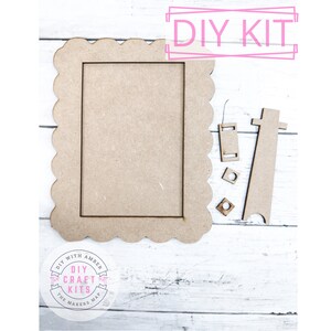 May include: DIY craft kit for making a scalloped picture frame. The kit includes a frame, a stand, and two small pieces of wood.
