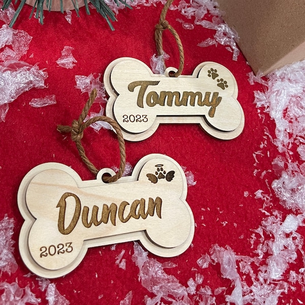 Dog Bone Wooden Ornament - Custom names - Wooden 3.5 inch wide Hanging tag. Laser cut ornament. Personalized wood ornament - dog ornament.