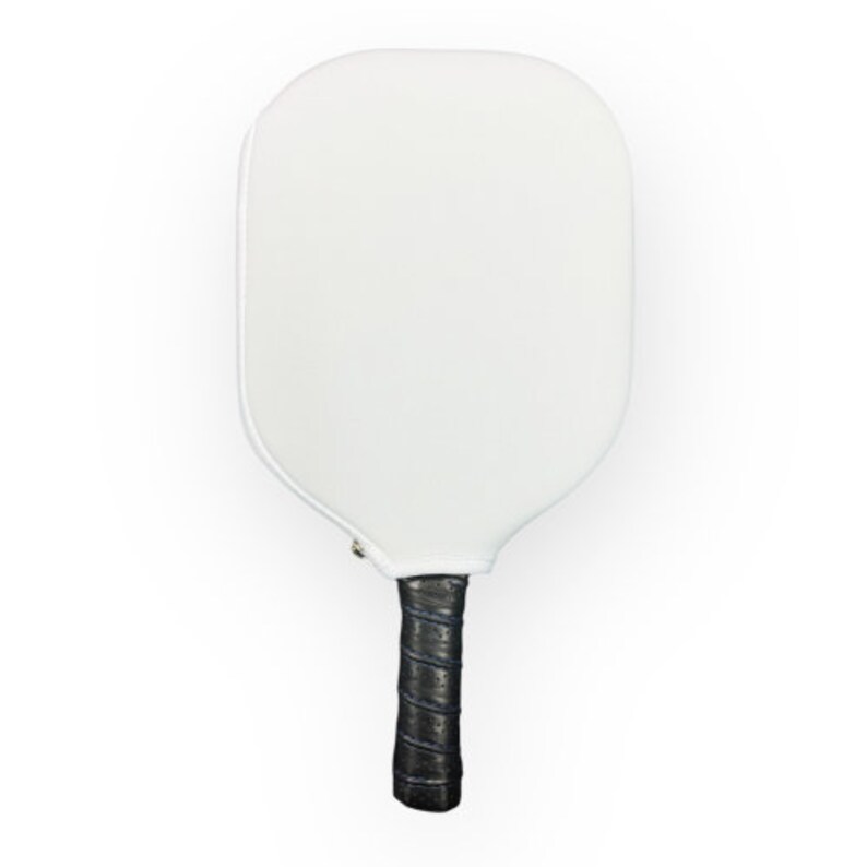 May include: White pickleball paddle with a black and blue grip.