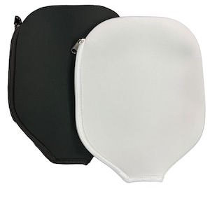May include: Two paddle covers, one black and one white, with zips. The covers are made of a soft, padded material and are designed to protect paddles from damage.