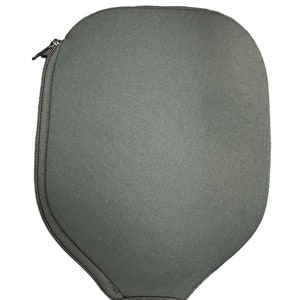 May include: A grey zipped case with a rounded shape, designed to protect a paddle.
