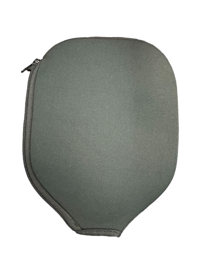 May include: A grey zipped case with a rounded shape, designed to protect a paddle.