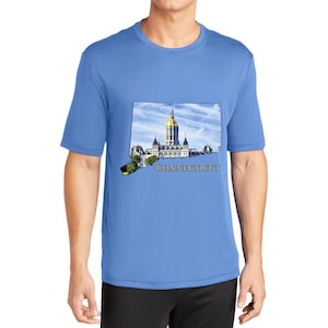 May include: A light blue t-shirt featuring a graphic of the state of Connecticut, with the state capitol building in Hartford. The text "CONNECTICUT" is printed below the graphic.